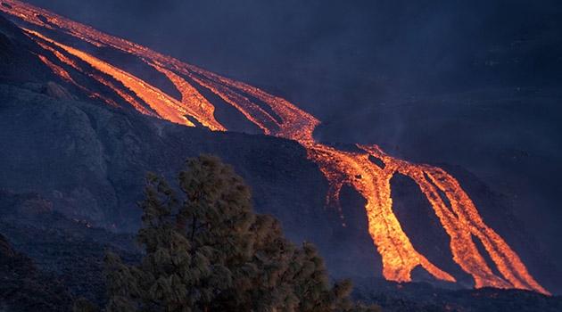 Fluid lava flows down the slope near the village of Tacande, La Palma, in early December 2021.