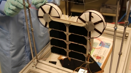 Unit set up for sun simulation tests. This side, which normally faces sun, contains a protective heat shield with solar cells for power supply.