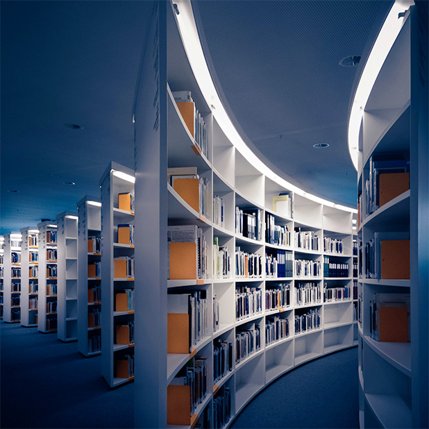 A line of curved bookshelves