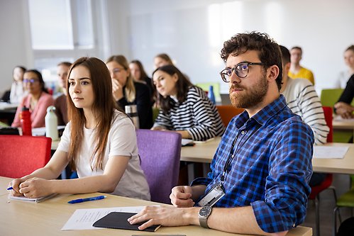 A student looking at a test in a lab.