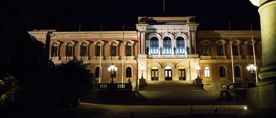Grand brick building with evening lighting.