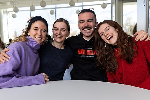Four smiling students.