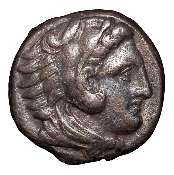 mynt med porträtt av ett ansikte i profil