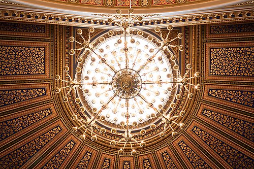 The ceiling of the Main University Building with the large chandelier in the centre.