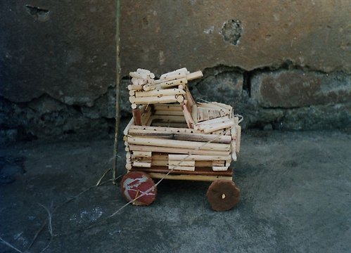 Toy armoured vehicle made of grass, called a “Mamba” with machine guns, Uganda. Photo by S. Finnström.