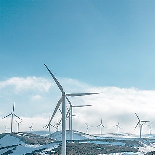 Wind turbines on snowy hills