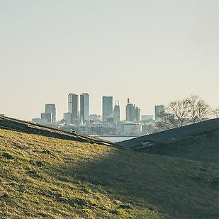 Two hills and a city skyline