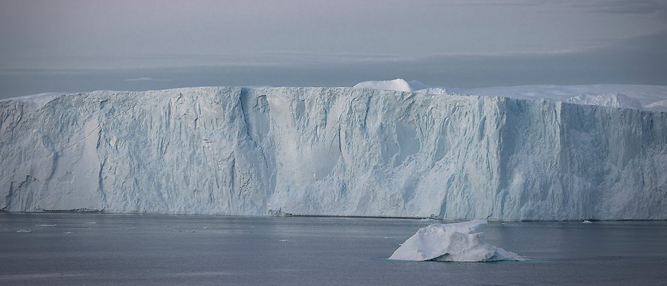 Iceberg in light blue water.