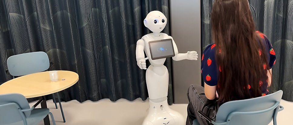 A robot interacting with a girl