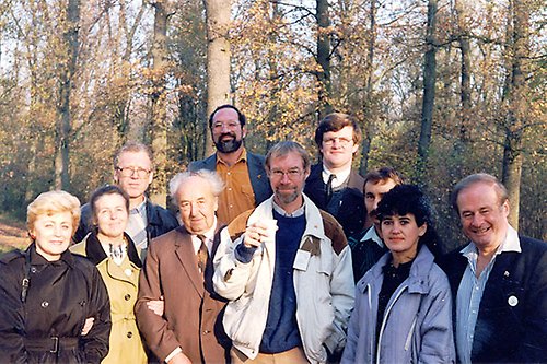 A group of people standing in the woods