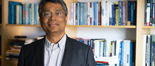 portrait of Ashok Swain with bookshelves in the background