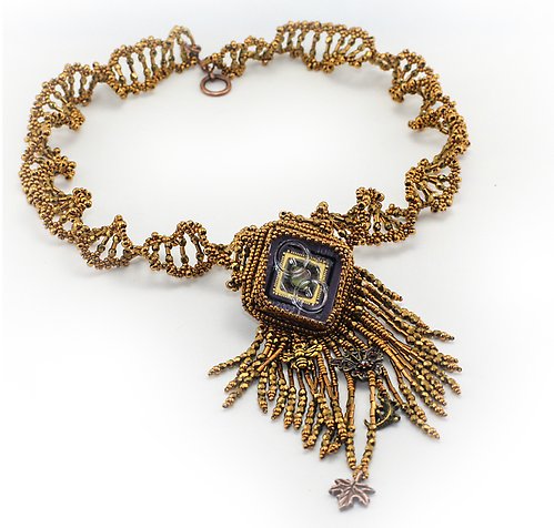 Beaded necklace in the form of a DNA sprial, decorated with an ION sequencing chip